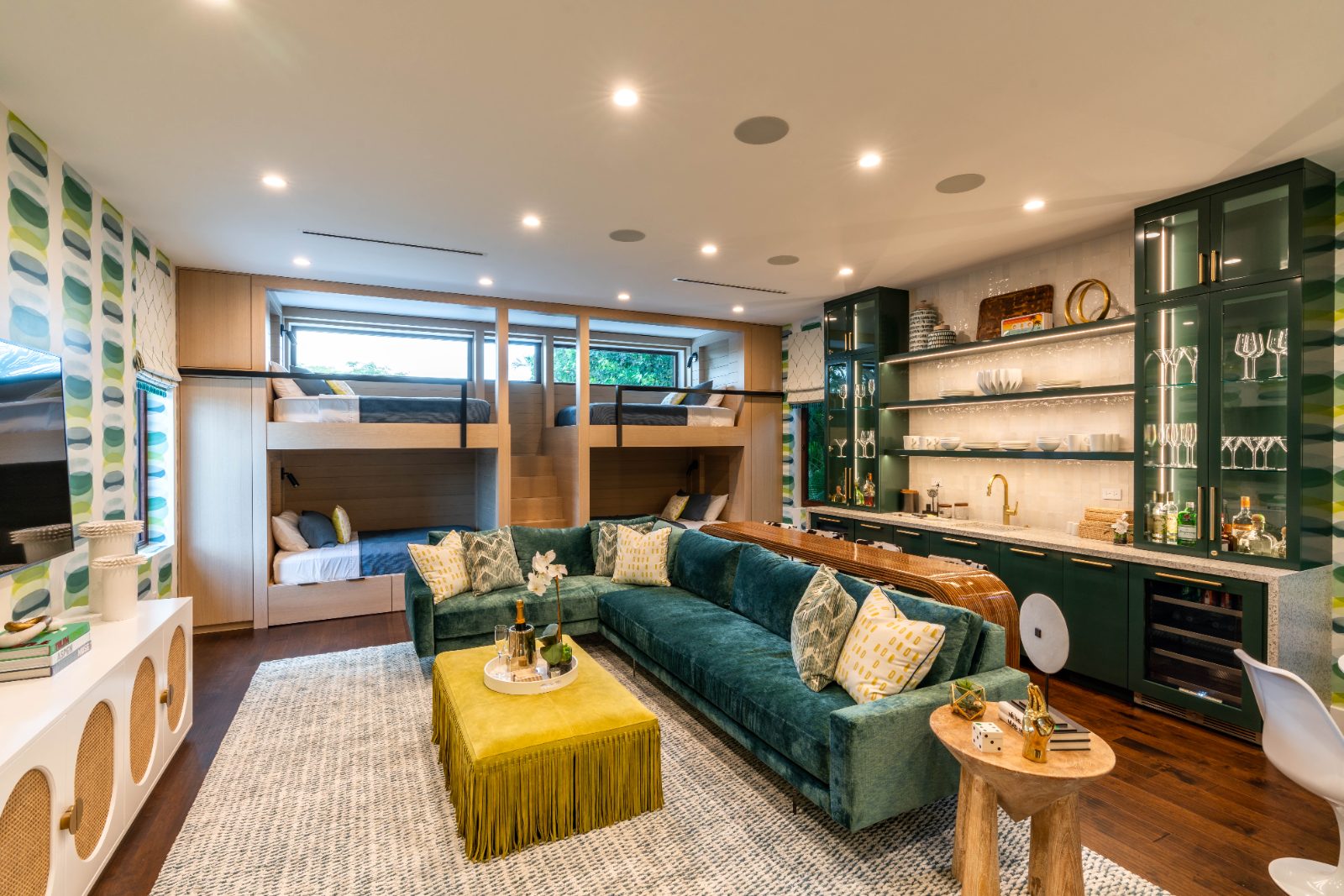 Custom bunk-and-lounge room with green built-in shelving, South Florida