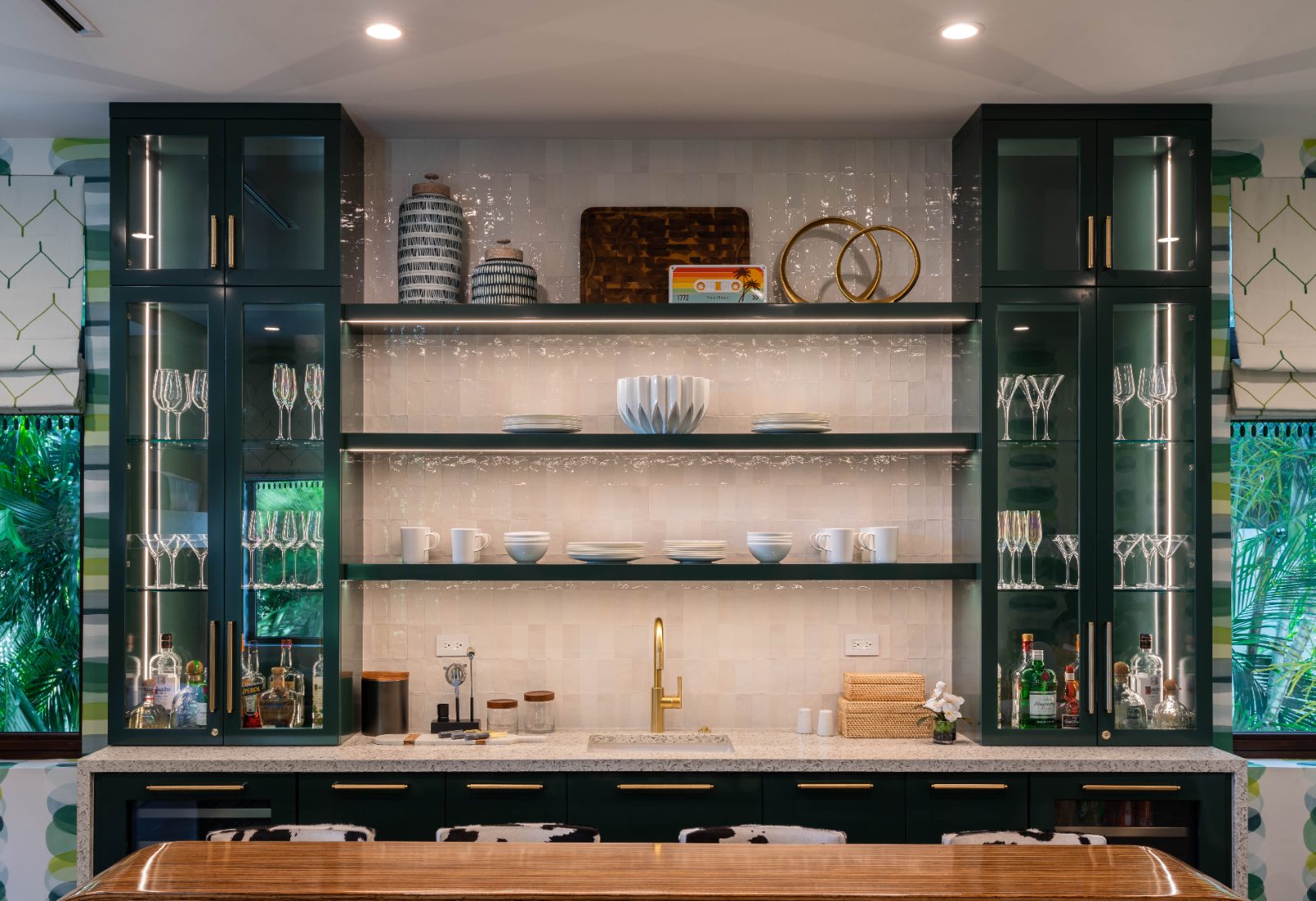 Emerald bar with glass display cabinets and gold hardware, South Florida