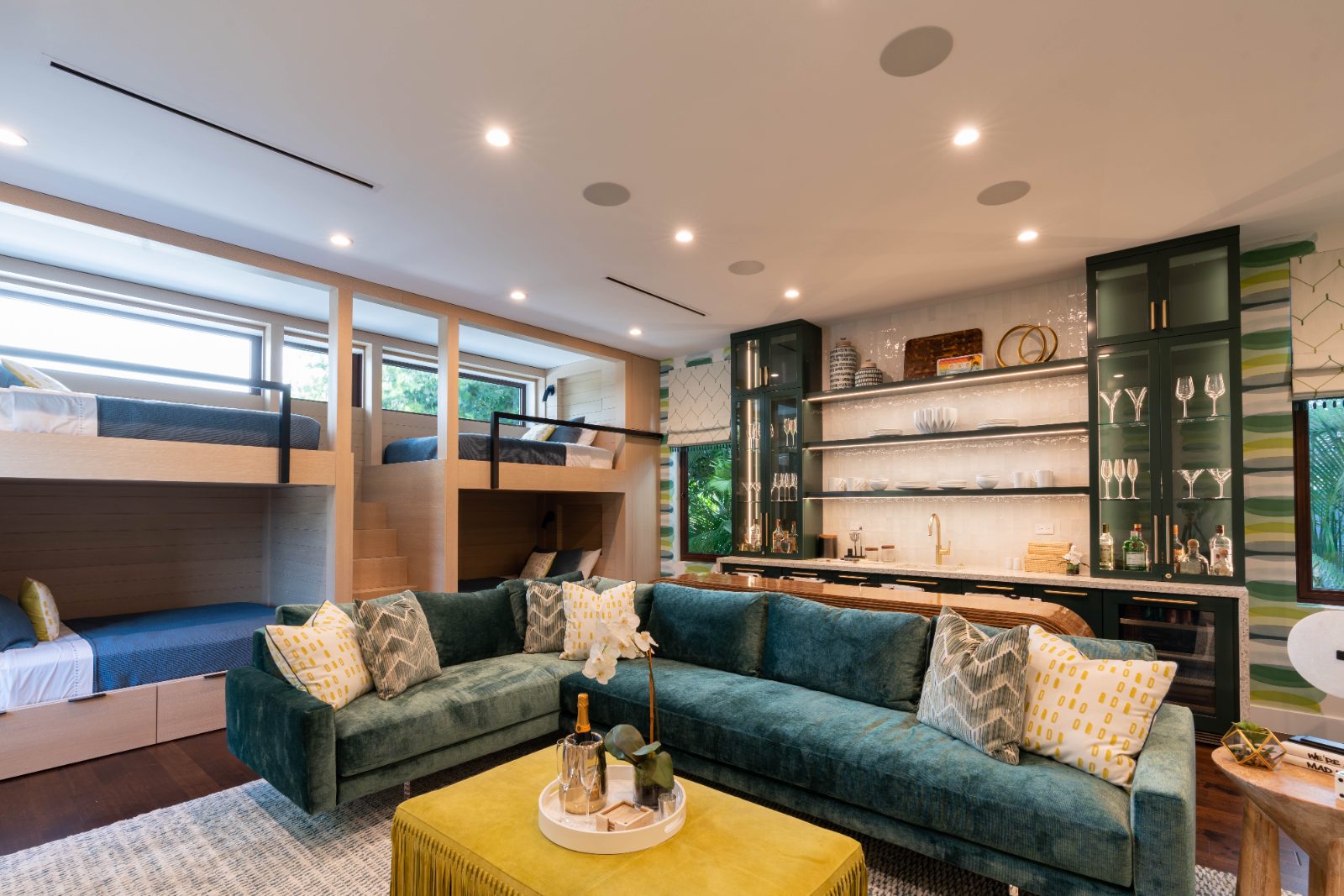 Lounge with custom green built-ins and sectional seating, South Florida